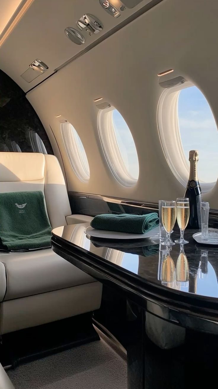 Champagne served on the table of a private cabin in flight